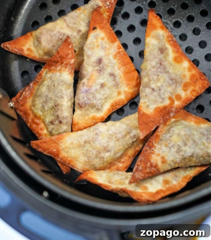 Crispy Air Fryer Ninja Foodi Crab Rangoon 7 Air fried wontons with a savory filling, perfect as a versatile air fryer appetizer or snack.
