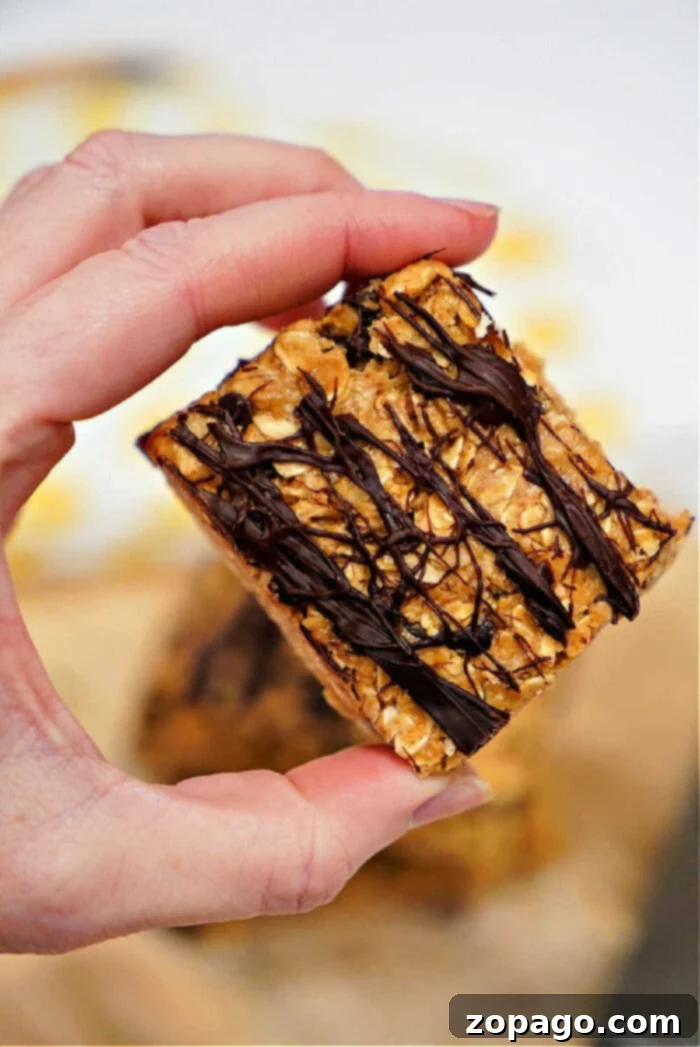 Viral TikTok Oatmeal Bars 8 A vibrant display of TikTok Oatmeal Bars, cut into squares and stacked, highlighting their appealing texture and easy grab-and-go nature.