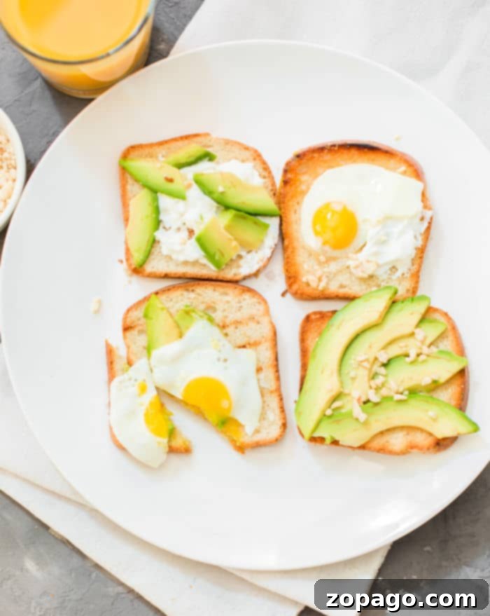Perfectly Crispy Oven Toast 2 Avocado toast ready on a baking sheet, showcasing how to make toast in the oven for easy batch preparation.