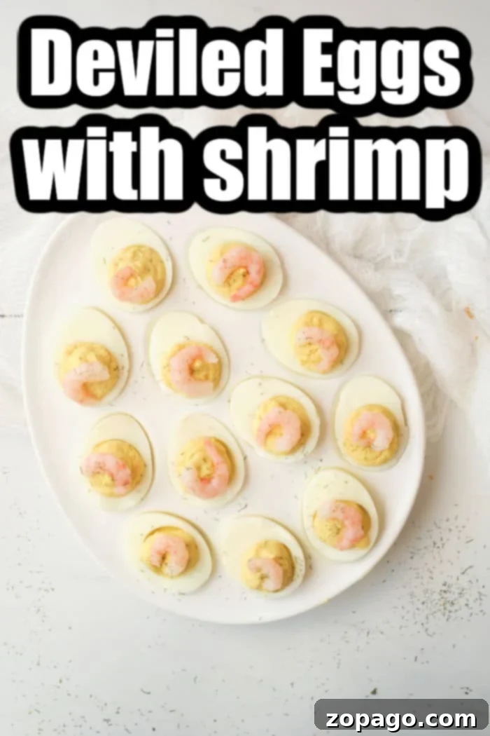 Gourmet Shrimp Deviled Bites 7 A vibrant platter of shrimp deviled eggs, garnished with fresh dill, ready to be enjoyed as a gourmet seafood appetizer.