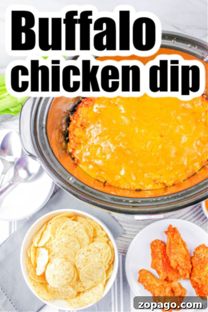 Ultimate Publix Buffalo Chicken Dip 7 A vibrant crockpot buffalo chicken dip, garnished with fresh green onions, served with a variety of dippers like celery sticks and chips, perfect for a party spread.