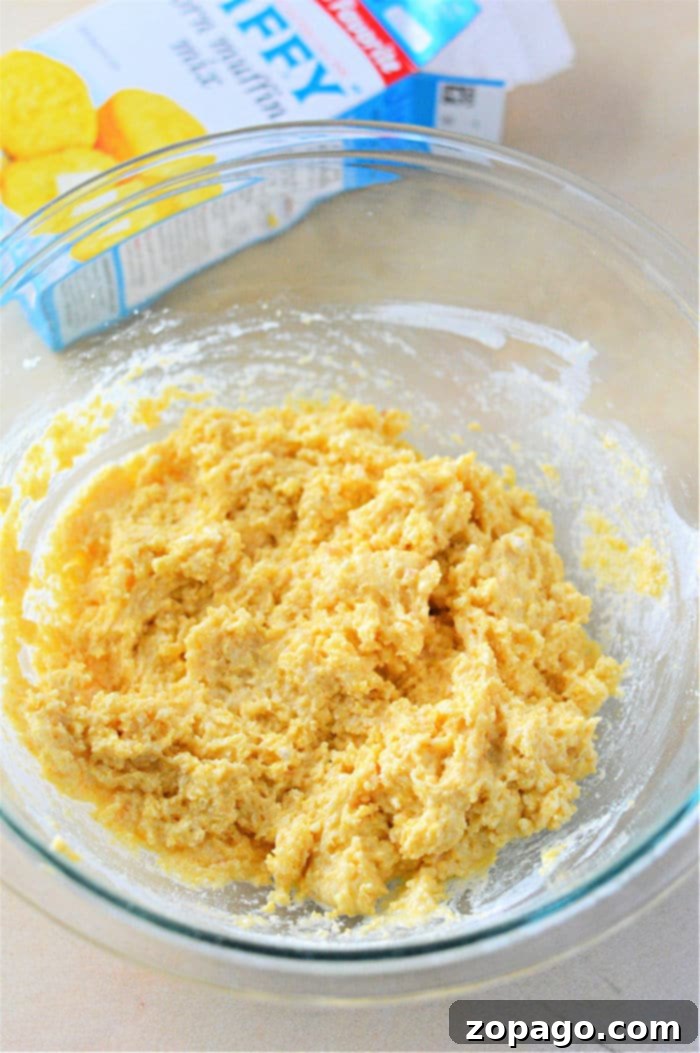 The Easiest Hush Puppies with Jiffy Mix 4 hush puppies batter in a bowl