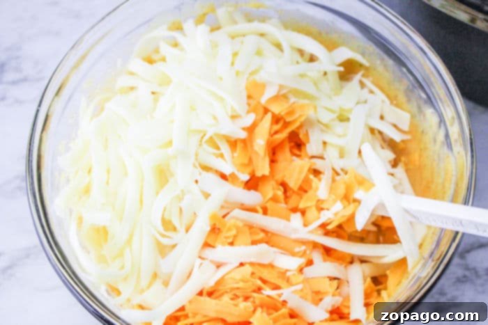 Slow Cooker Cheesy Cauliflower Mac and Cheese 6 shredded cheese ready for topping