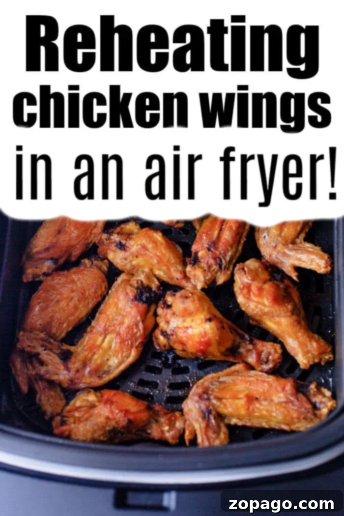 Crispy Leftover Chicken Wings in the Air Fryer 5 A basket full of perfectly reheated, golden-brown chicken wings, showcasing their appealing crisp texture, ready to be served.