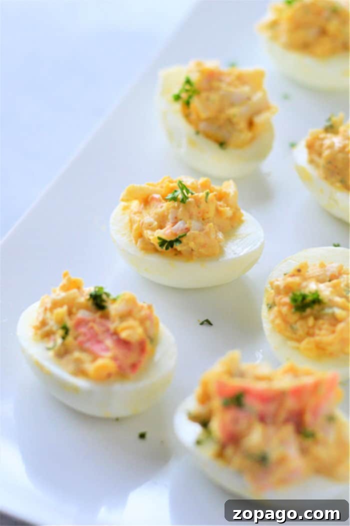 Savory Crab Deviled Eggs 4 Beautifully piped deviled eggs with crab, ready for serving