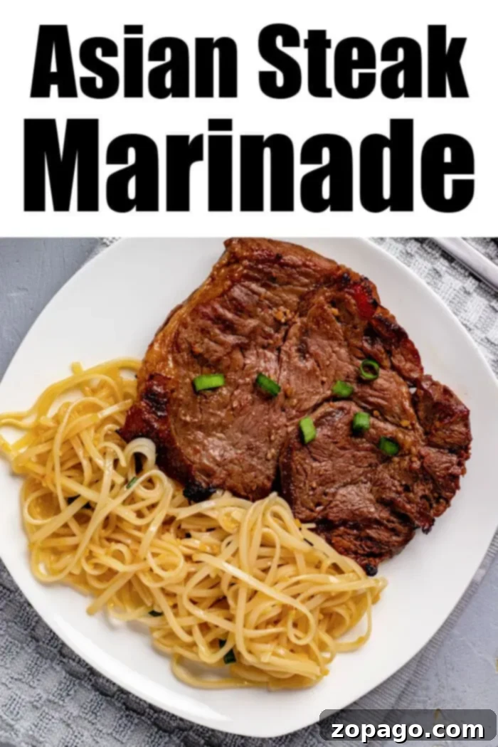 Grilled steak topped with green onions and a side of noodles on a white plate, with 'Asian Steak Marinade' text, all on a grey surface.