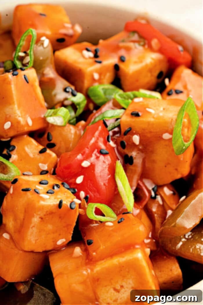 Tangy Tofu Wok Toss 2 Crispy tofu with vibrant sweet and sour sauce, bell peppers, and pineapple