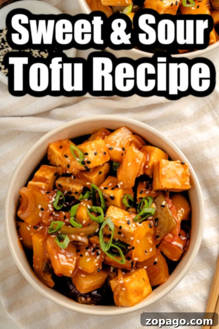 Tangy Tofu Wok Toss 7 A close-up shot of sweet and sour tofu being served, with steam rising
