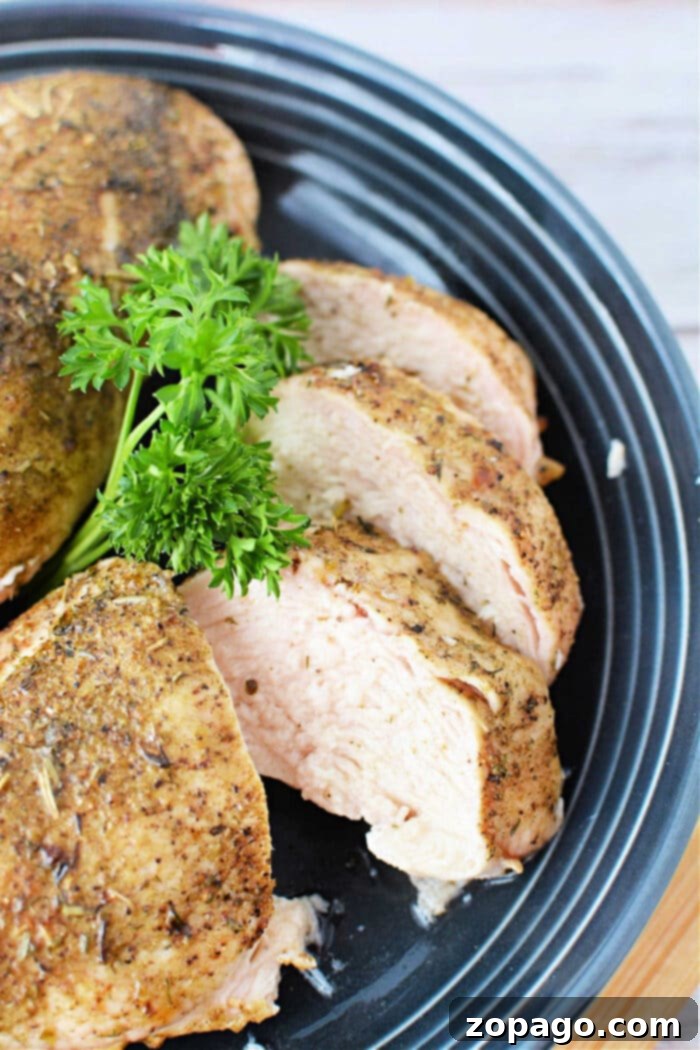 Effortless Oven-Baked Frozen Chicken Breast 2 Frozen chicken breasts arranged on a baking sheet, ready for the oven