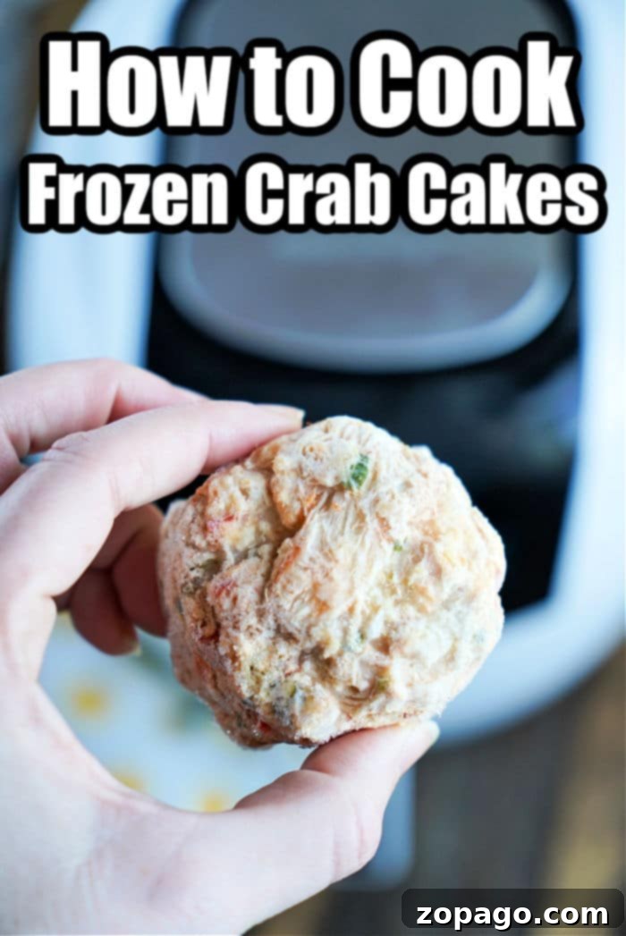 Crispy Air Fryer Frozen Crab Cakes 4 Three golden-brown air fryer crab cakes, perfectly cooked and ready to serve.