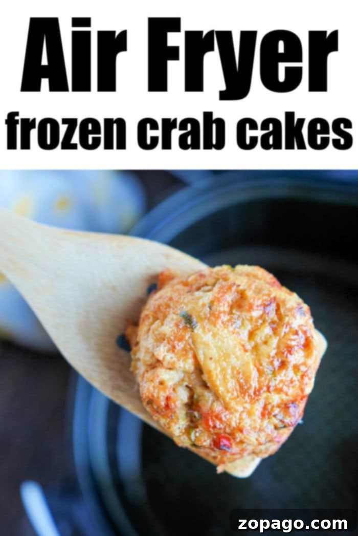 Crispy Air Fryer Frozen Crab Cakes 6 Air fryer basket filled with crispy frozen crab cakes, prepared to perfection.