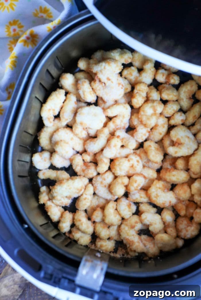 Perfectly Crispy Air Fryer Popcorn Shrimp 7 Shrimp in Air Fryer with a squeeze of lemon