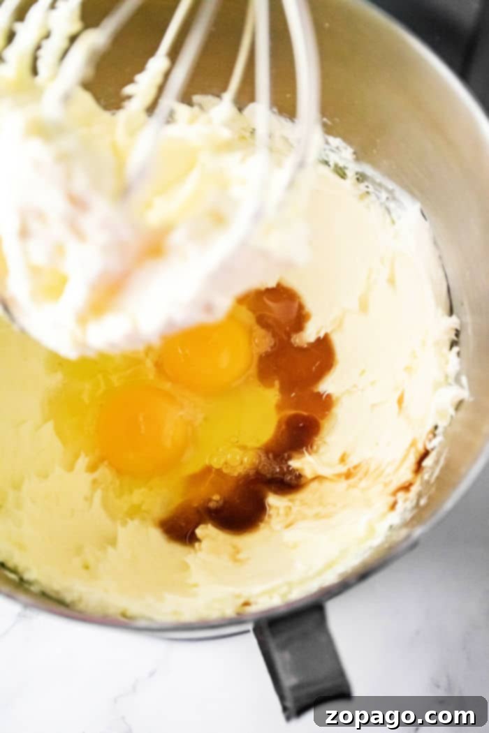 Creamy Cheesecake Delights 3 Detailed shot showing ingredients being mixed for the creamy cheesecake filling.