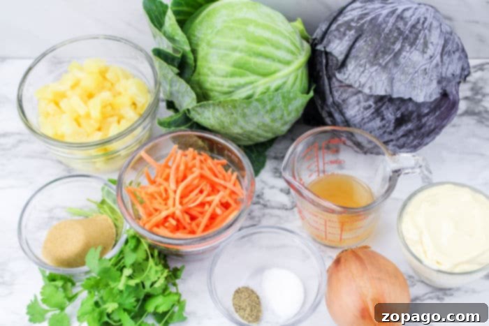 Creamy Hawaiian Pineapple Slaw 3 Ingredients for homemade Hawaiian coleslaw, including red and green cabbage, carrots, cilantro, pineapple tidbits, and dressing components.