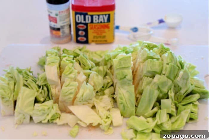 Golden Southern Skillet Cabbage 4 Freshly chopped green cabbage, cut into uniform cubes, ready for cooking.