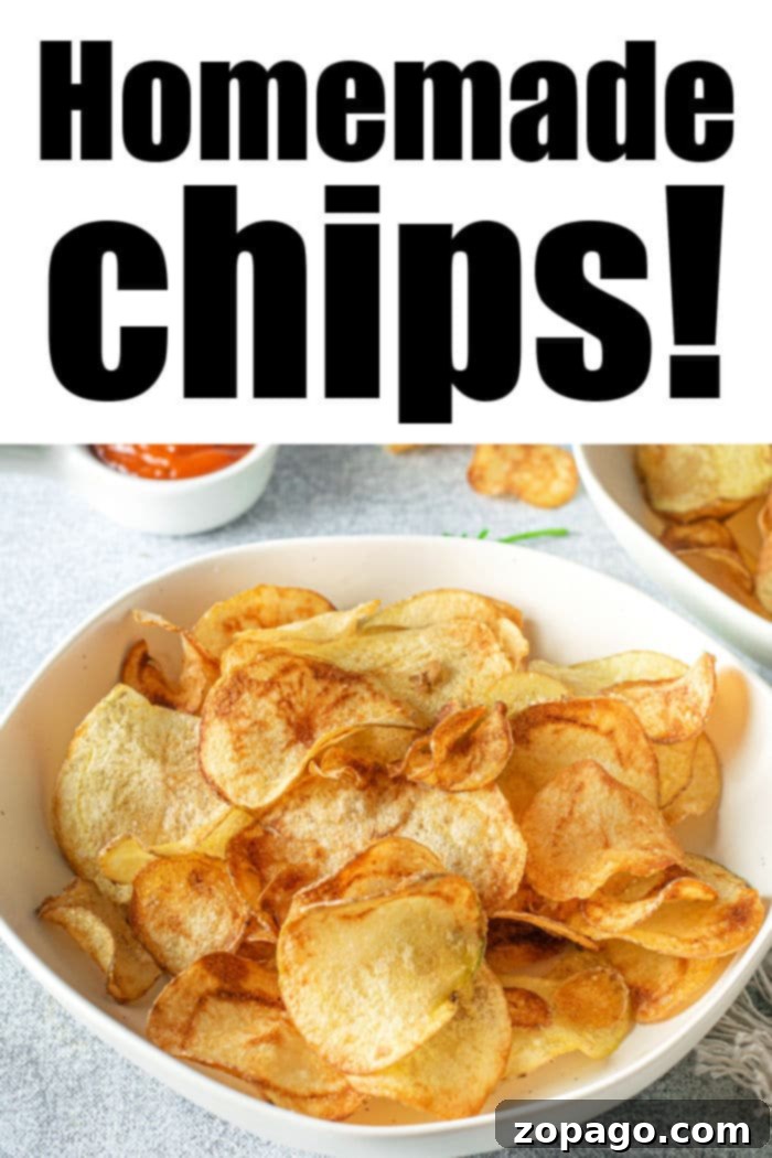 Russet Gold Crisps 7 A close-up of golden homemade potato chips in a bowl, showing their crispy texture.
