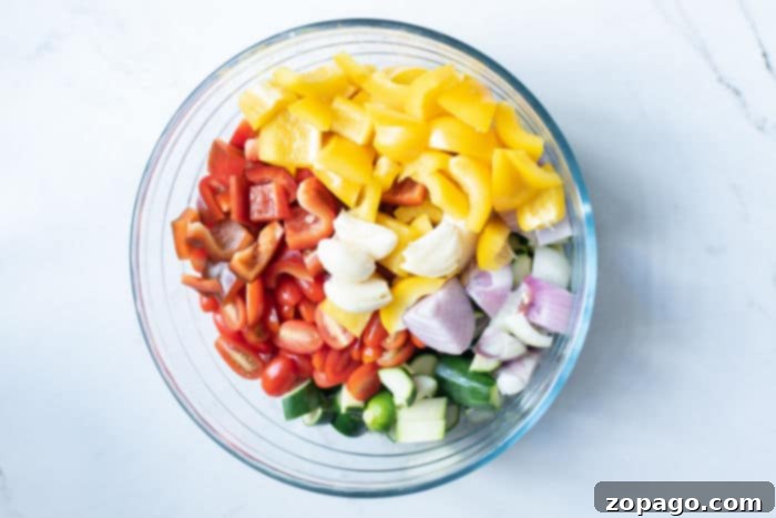 Crispy Mediterranean Air Fryer Vegetables 4 A vibrant mix of roasted Mediterranean vegetables, including peppers, zucchini, and cherry tomatoes, perfectly charred and seasoned.