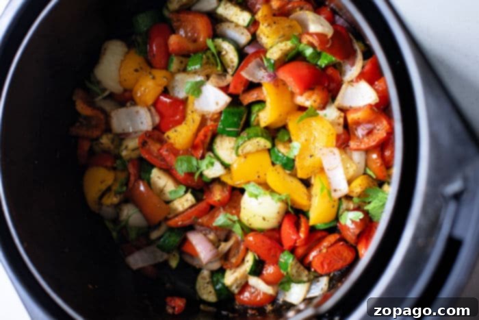 Perfect Air Fryer Mediterranean Roasted Vegetables 9 An overhead shot of a large bowl filled with various air fryer mixed vegetables, showcasing their readiness to be served as a side or main dish.