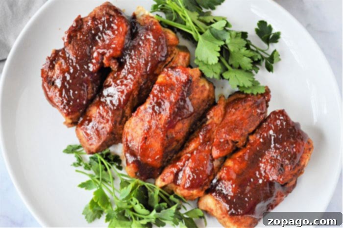 Delicious Ninja Foodi Pork Creations 4 A dish of instant pot Pork Ribs, tender and coated in a rich sauce.