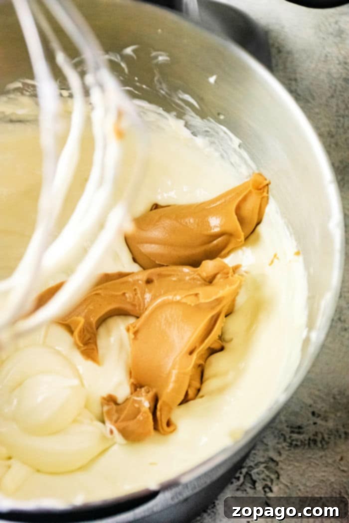 Close-up of the creamy peanut butter cheesecake filling before baking.