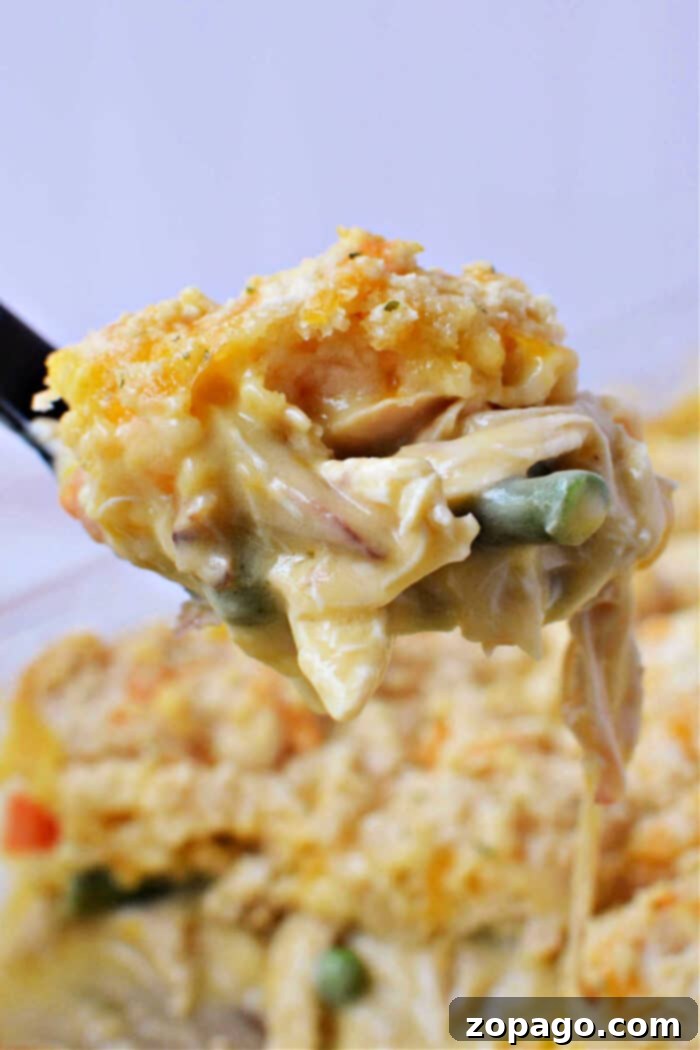 Chicken Pot Pie Topped with Cheddar Bay Biscuits 2 Close-up shot of creamy chicken pot pie with vegetable filling and cheddar biscuit topping