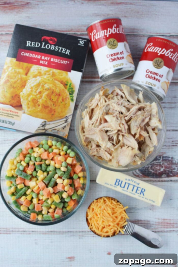 Chicken Pot Pie Topped with Cheddar Bay Biscuits 3 Ingredients for Chicken Pot Pie with Red Lobster Biscuits: Cream of chicken soup, milk, frozen vegetables, chicken, biscuit mix, cheese, and butter.