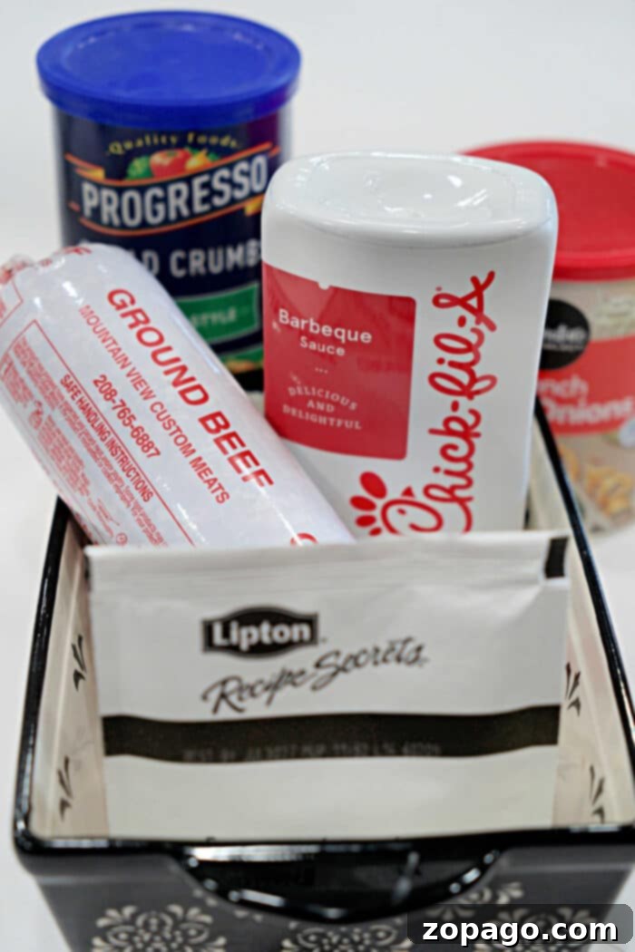 Smoky BBQ Meatloaf Perfection 3 A basket with ground beef, Chick-fil-A sauce, Lipton soup mix, bread crumbs, and cream of chicken soup—everything you need for a delicious BBQ Meatloaf Recipe.