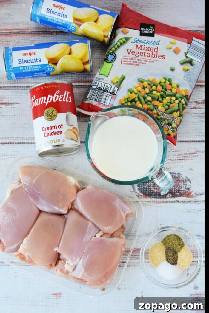 Slow-Cooker Chicken Pot Pie: Creamy One-Pot Dinner Recipe 3 Ingredients for a Chicken Pot Pie casserole: biscuits, frozen mixed vegetables, cream of chicken soup, milk, chicken, and spices—perfect for baking or making in your Crockpot.