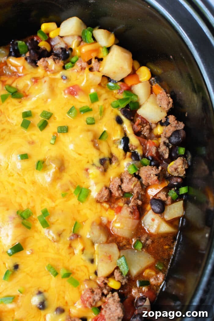 Slow Cooker Cowboy Casserole 2 Enjoy this hearty Cowboy Casserole Crockpot dish—cheesy ground beef, potatoes, black beans, corn, and green onions all slow-cooked to perfection.